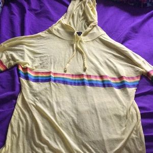 a long sleeve sheer yellow & rainbow shirt.